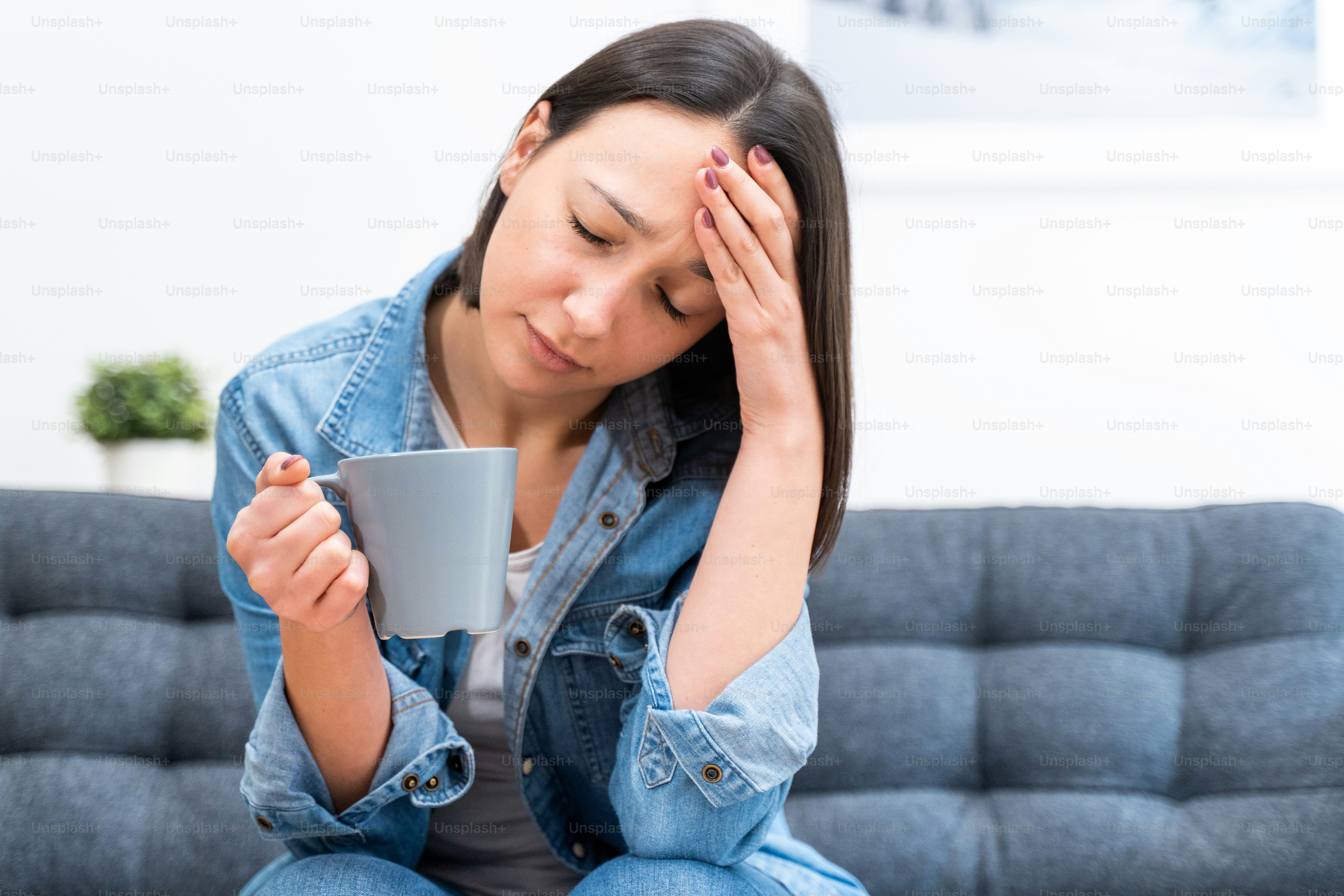 Single young woman sad and lonely at home