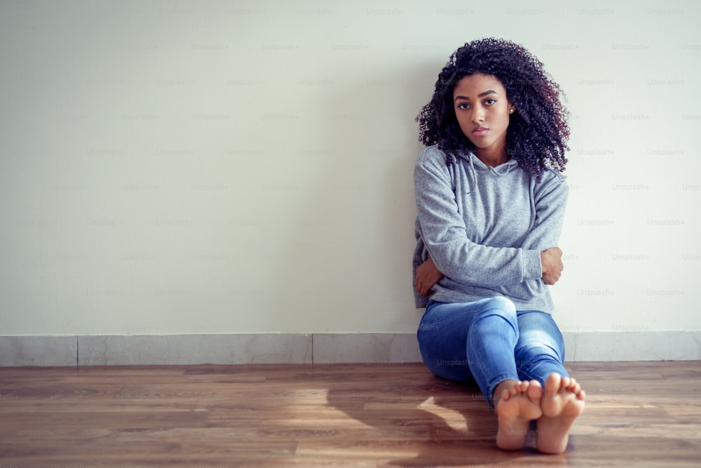 Portrait of black girl suffering solitude and depression