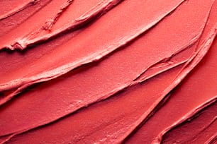 Verschmiert und verschmiert leuchtend rot orange Koralle lila scharlachrot rosa kastanienbraun strukturierte Tönung oder Lippenstift mehrfarbiger Hintergrund