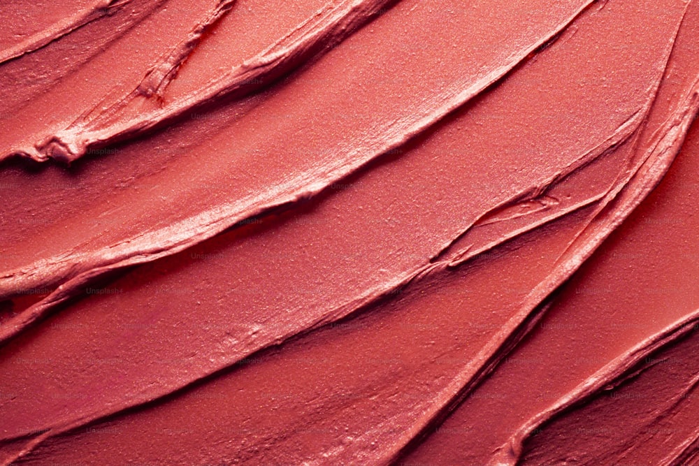 Verschmiert und verschmiert leuchtend rot orange Koralle lila scharlachrot rosa kastanienbraun strukturierte Tönung oder Lippenstift mehrfarbiger Hintergrund