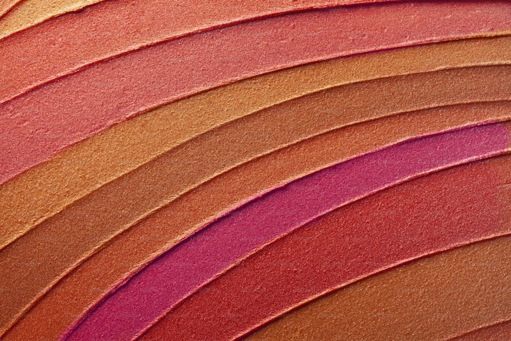Sbavato e sbavato vibrante rosso arancione corallo viola scarlatto rosa bordeaux testurizzato tinta o rossetto sfondo multicolore