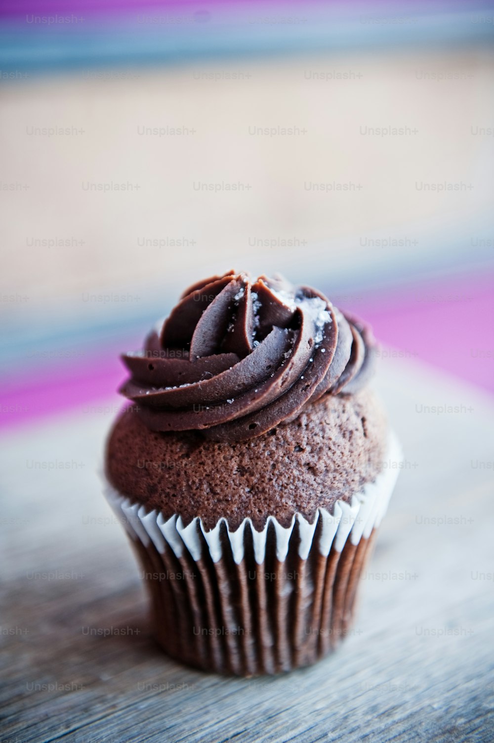 A cupcake with icing is seen