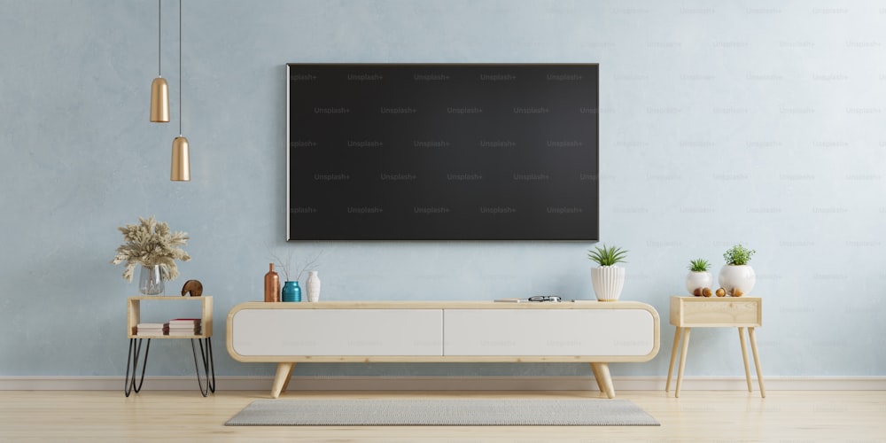 TV en el gabinete de la sala de estar moderna sobre fondo de pared azul, renderizado 3d