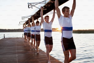 a group of people standing on a dock