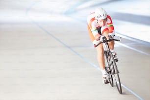 a person riding a bike on a track