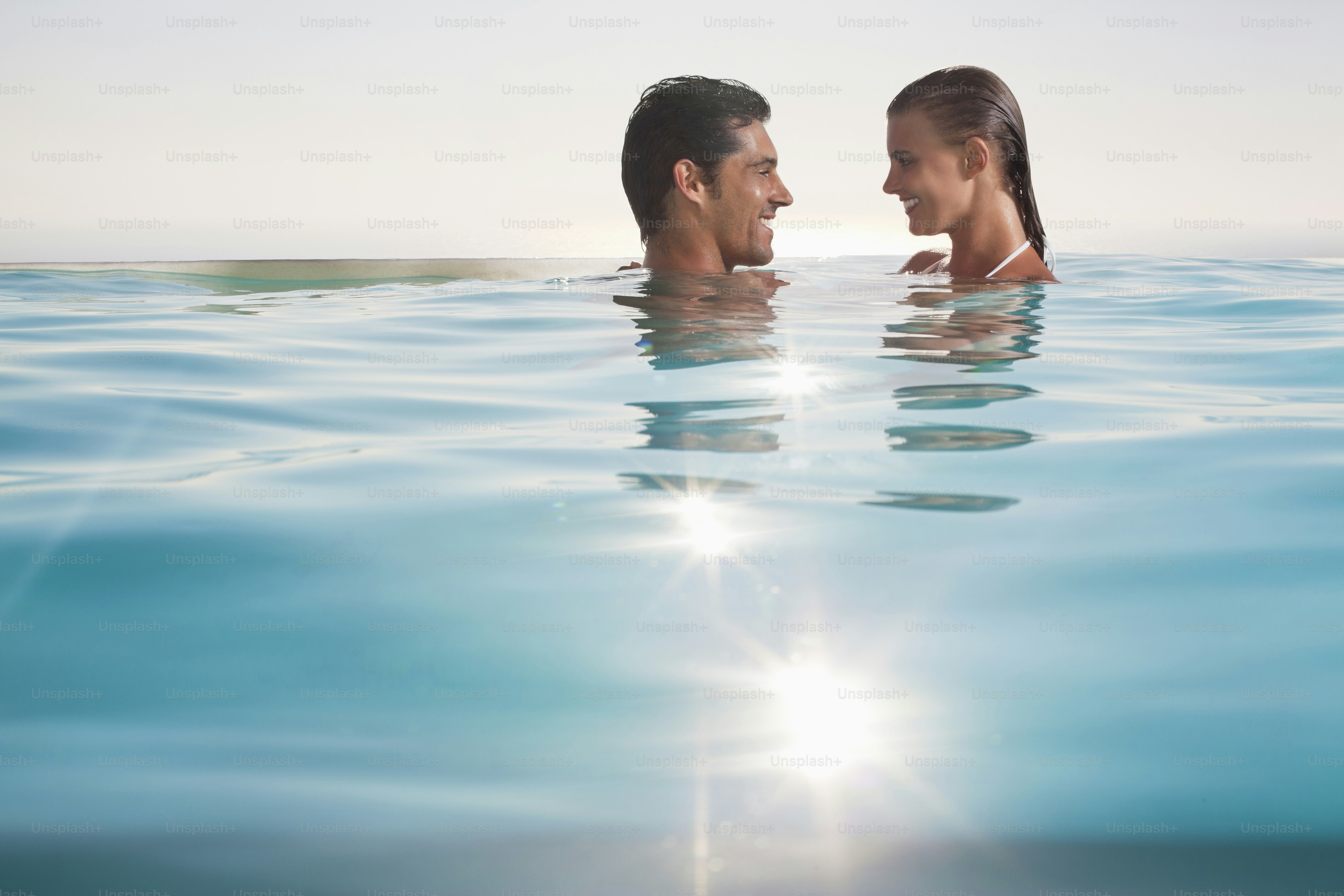 a man and a woman are in the water