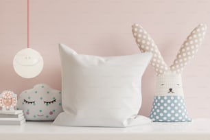 Mockup pillow in the children's room on light pink colors wall background.3D Rendering