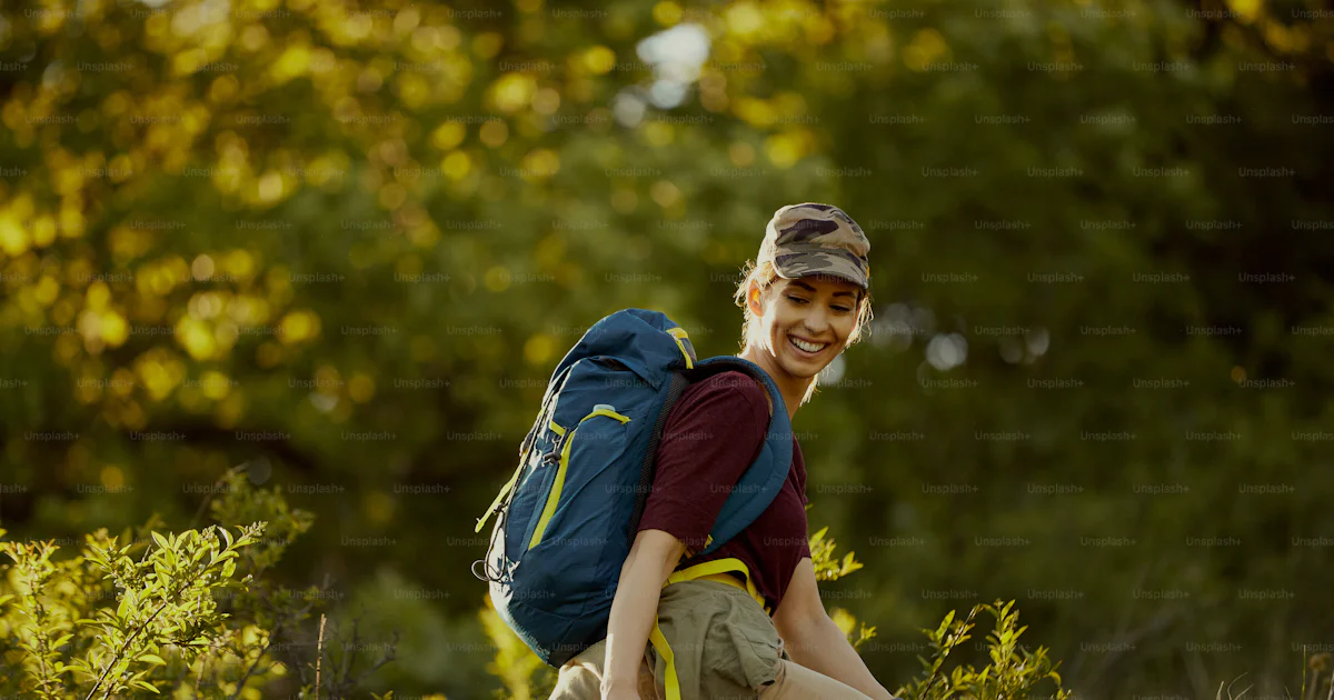 Young Backpackers Young happy backpacker spending her day in hiking through nature. photo ...