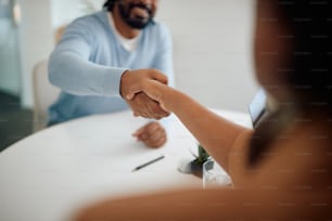 Close-up of business colleagues handshaking on a meeting in the office.