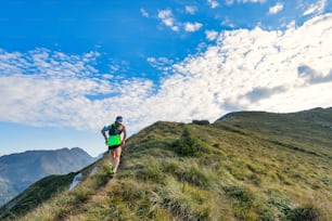 Sporty mountain man rides in trail during endurance race