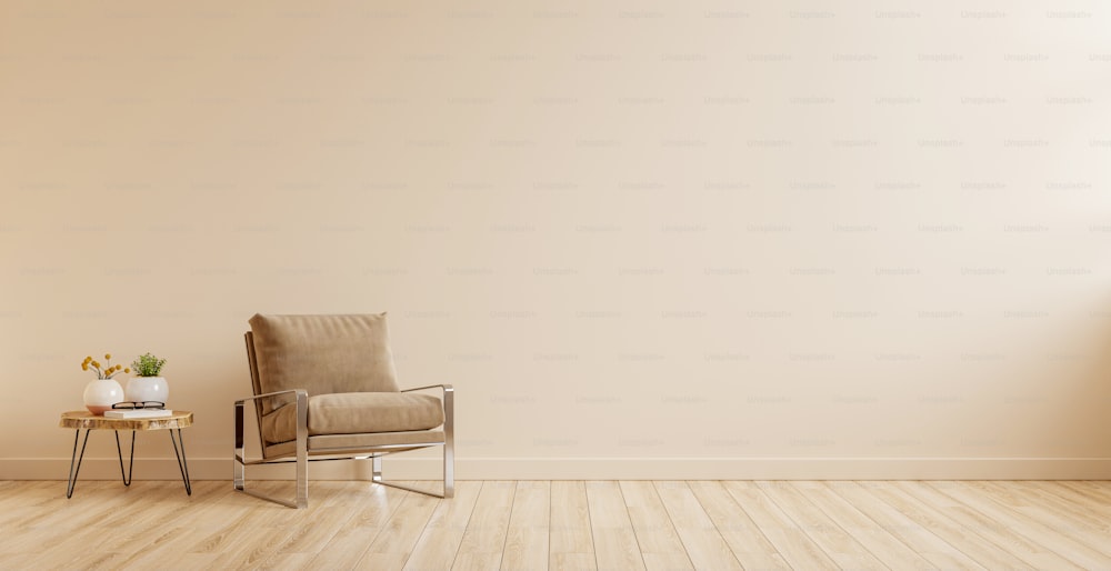 Modern minimalist interior with an armchair on empty cream color wall background.3d rendering