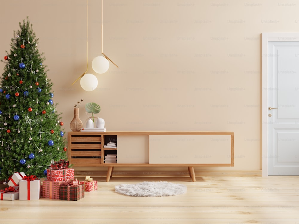 Living room at Christmas held in a cream colored room.3D rendering