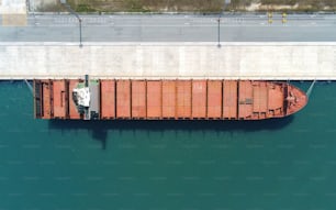 Aerial top view containers ship cargo business commercial trade logistic and transportation of international import export by container freight cargo ship in the open seaport.