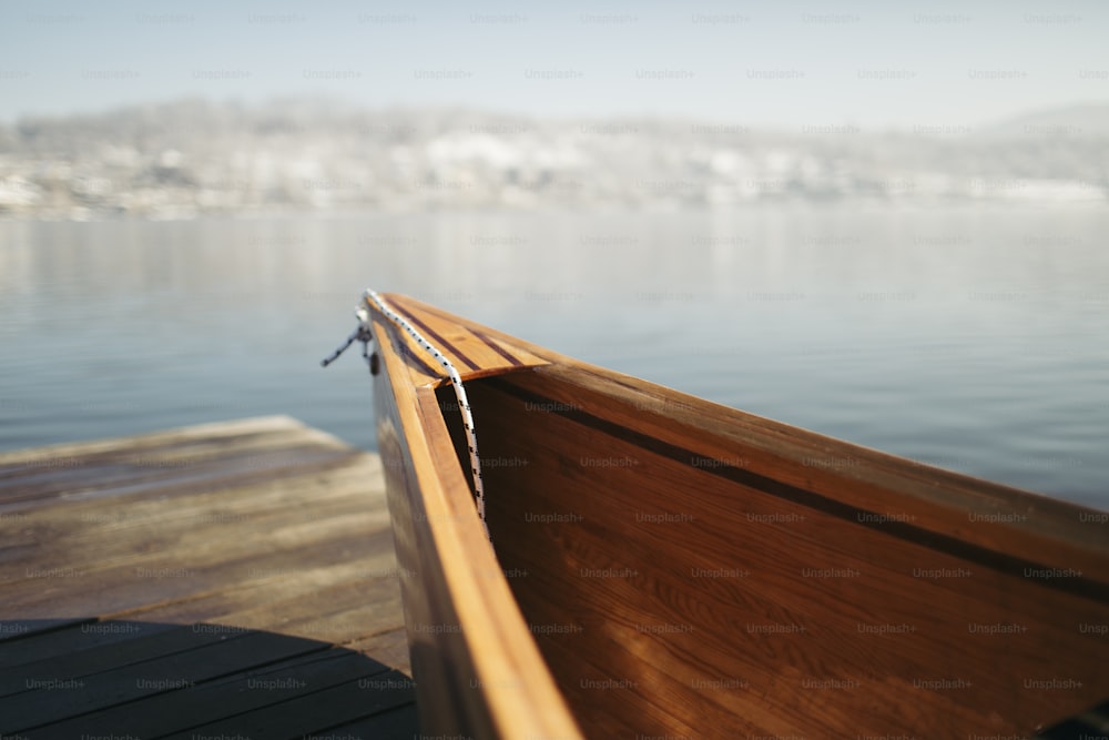 Canoe on lake in the winter morning.