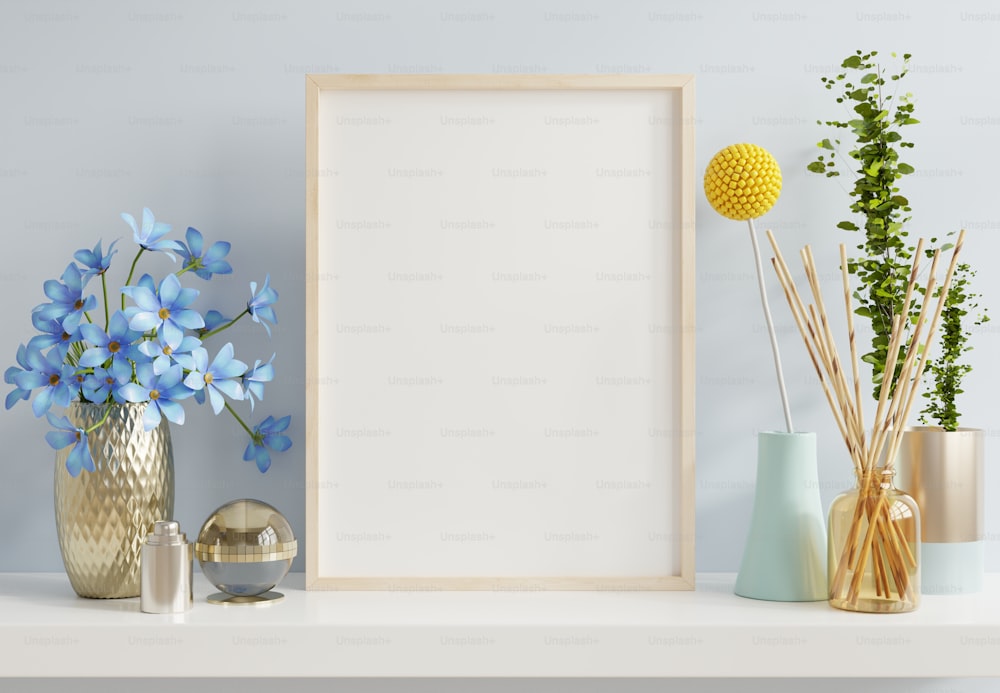 Interior poster mockup with vertical wooden frame in blue interior background.3d rendering