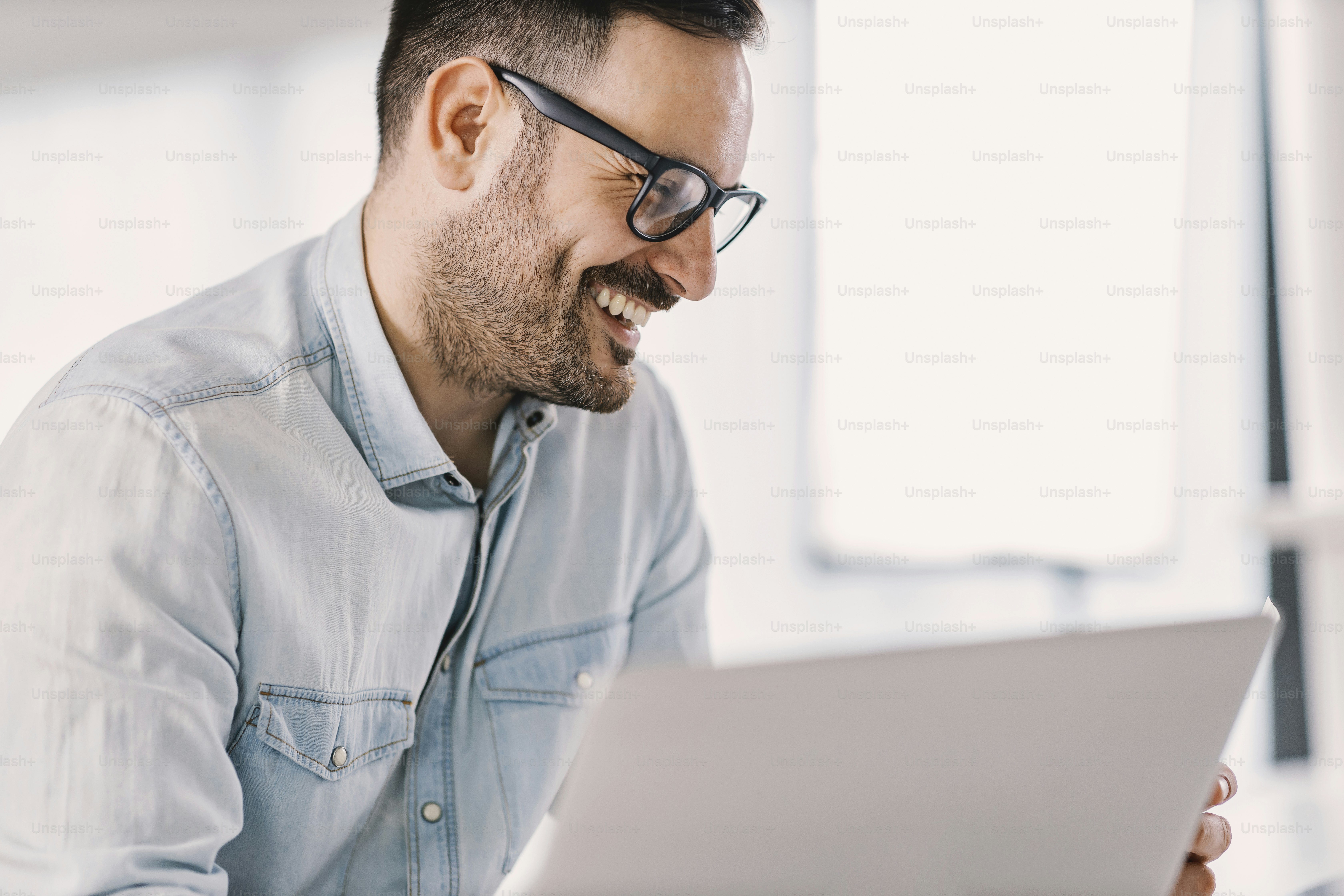 A smiling freelancer working at home office. photo – Business Image on ...