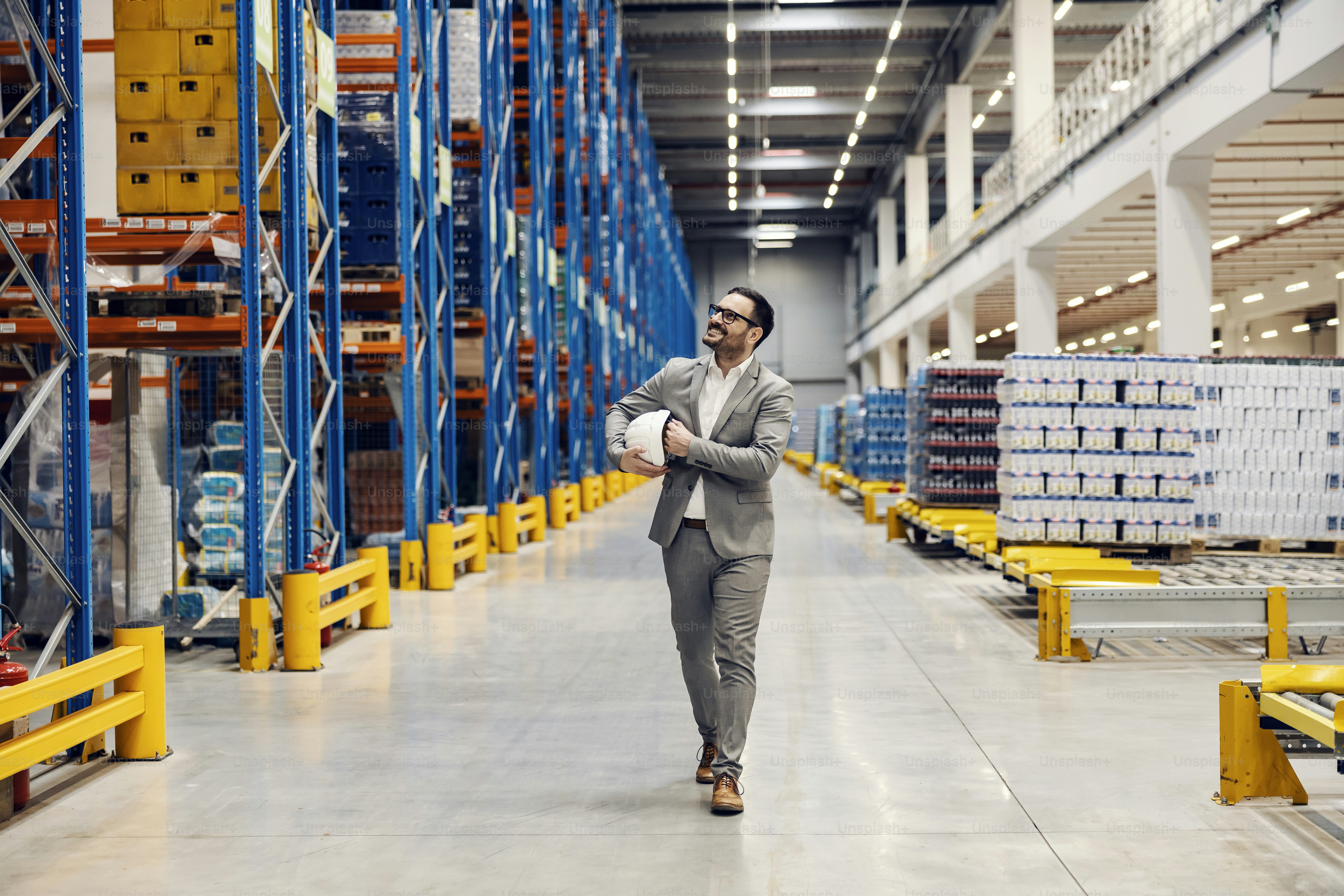 A storage owner walking in storage and looking around