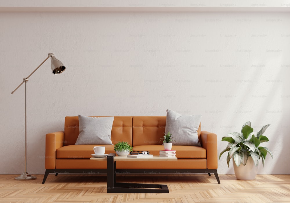 Living room wall mock up with leather sofa and decor on white plaster wall background.3d rendering
