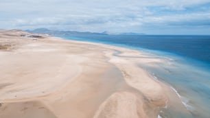 Aerial view of tropical caribbean white sand beach and transparent clean water with blue ocean and sky in background. Concept of scenic travel destination for summer holiday vacation