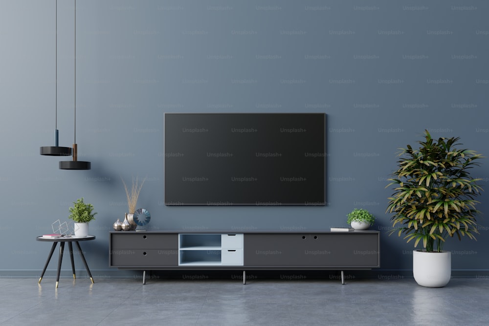 TV LED sulla parete blu scuro nel soggiorno, design minimale.3d rendering
