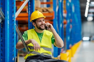 A storage worker having phone call with the customer.