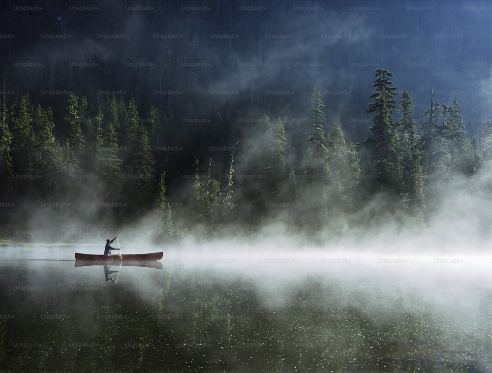 Mans Reflection on lake, Madely Lake, Whistler, British Columbia, Canada, September 2003