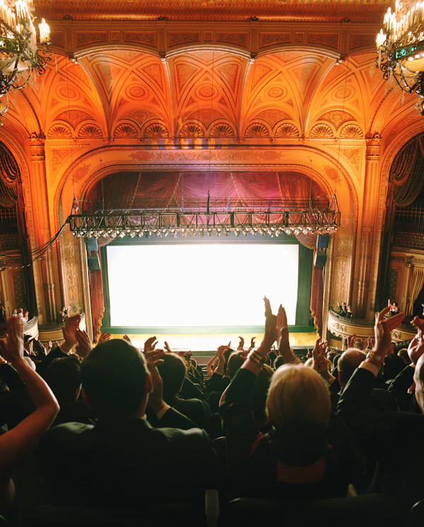 New York City gala venue - a crowd of people sitting in front of a stage