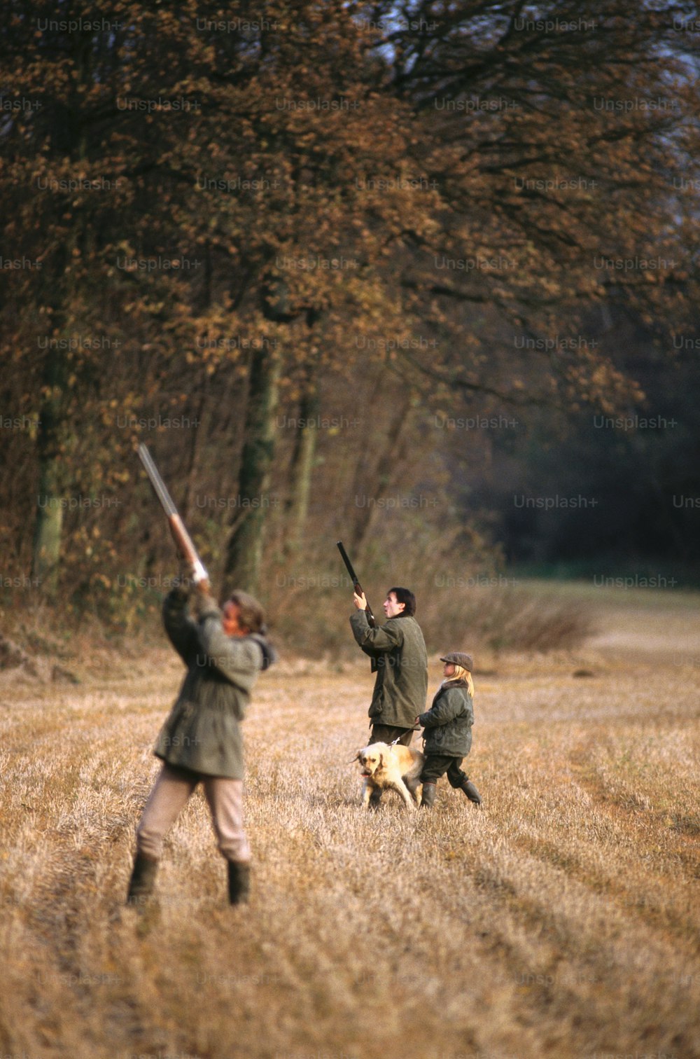 a group of people playing baseball in a field