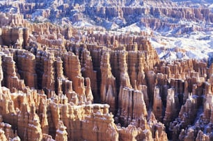 a large group of rock formations covered in snow