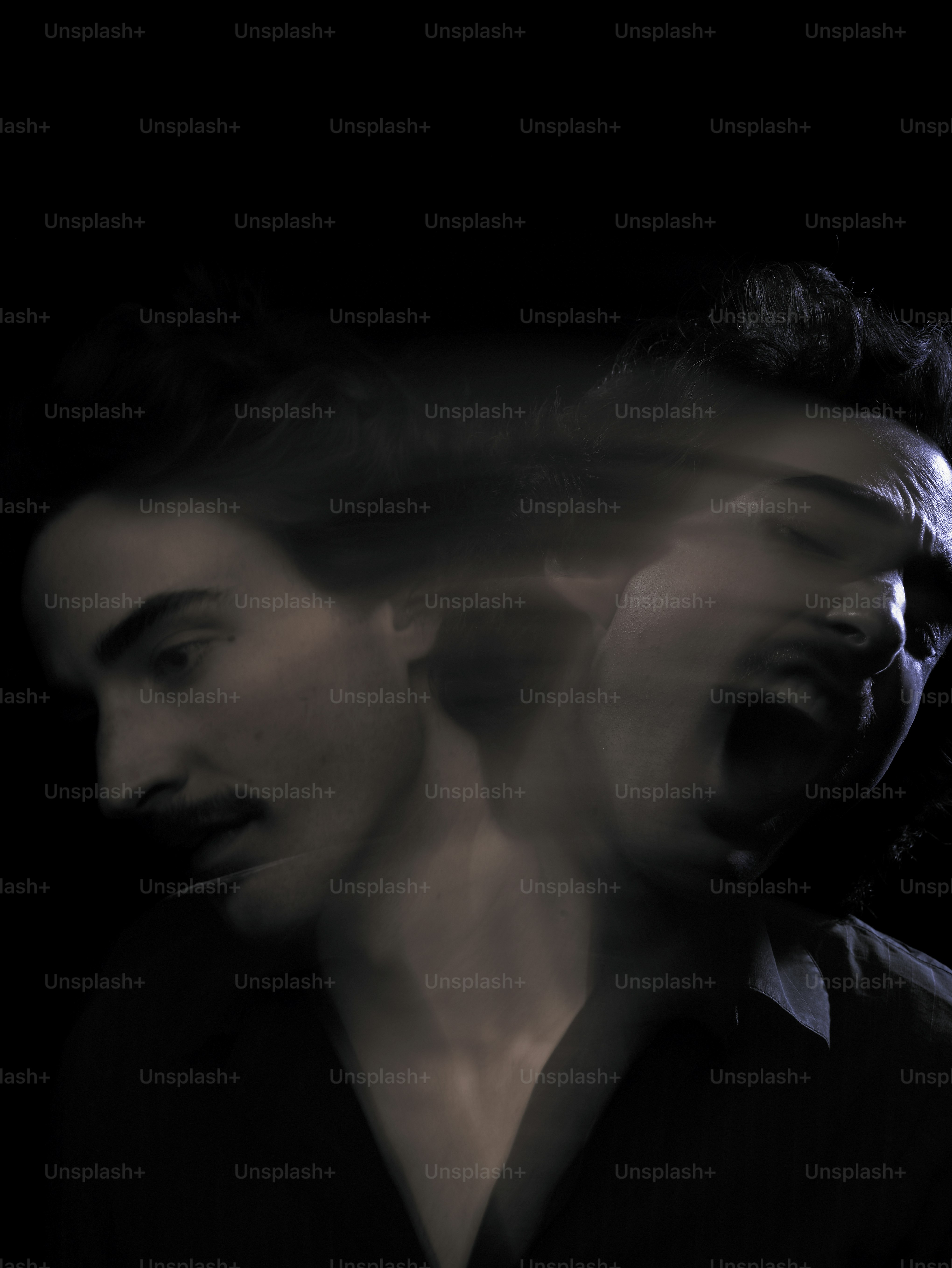 a blurry photo of a man in a black shirt