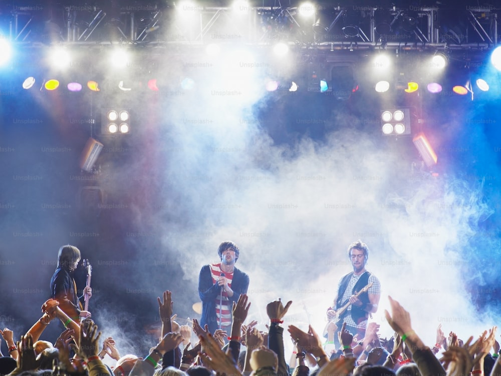 a group of people standing on top of a stage