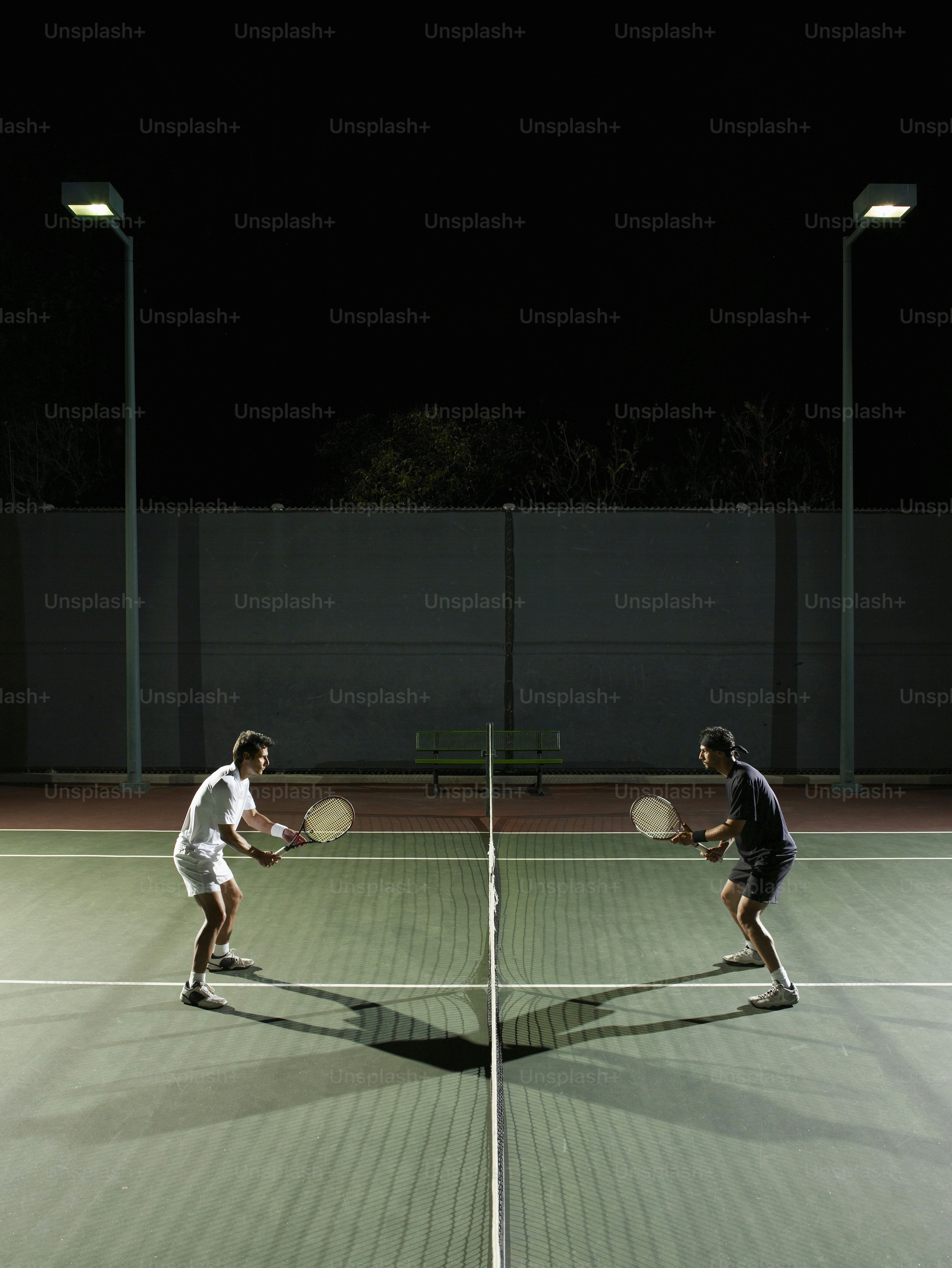 Two tennis players shaking hands over a racket photo – Tennis racket ...