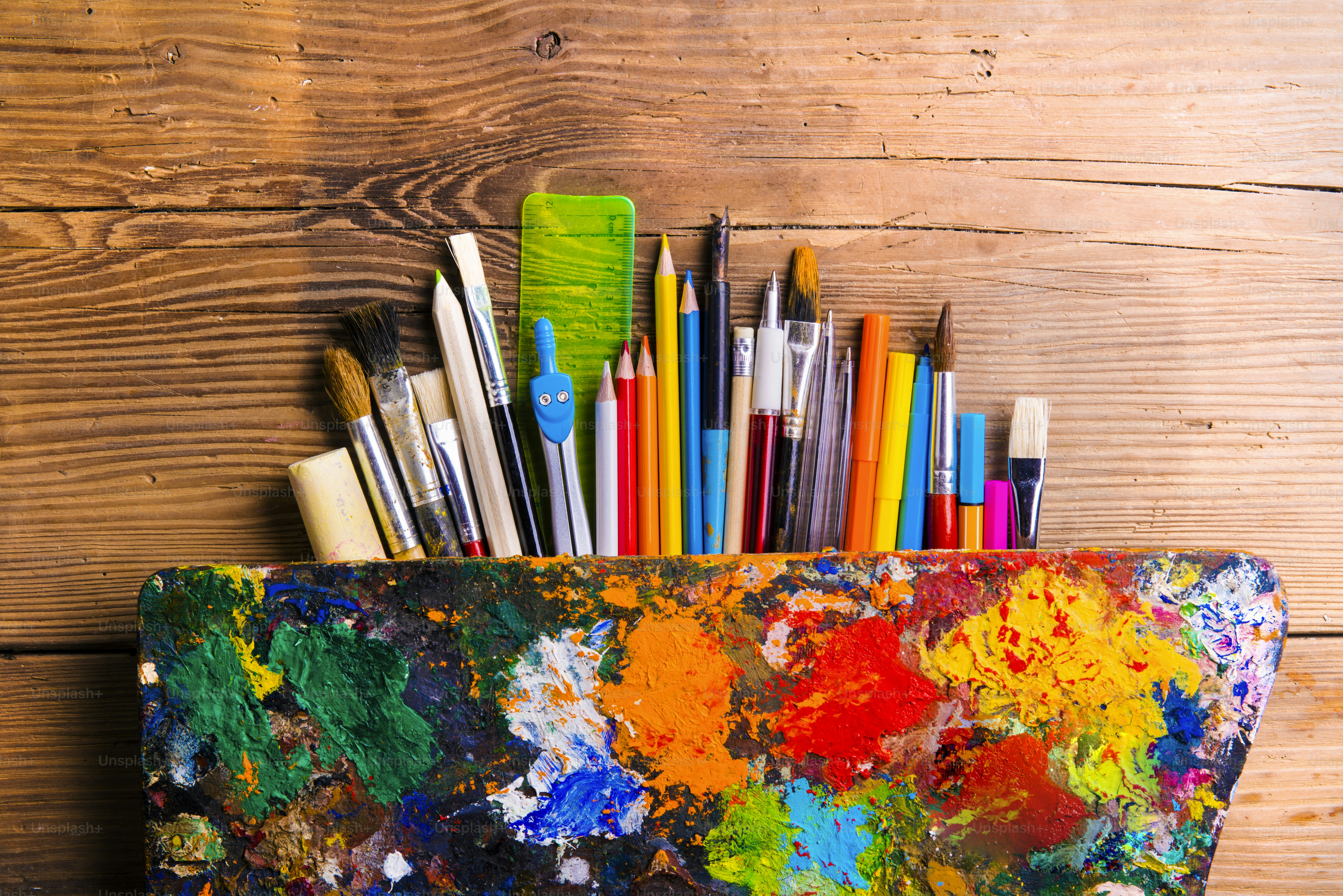 Desk with stationary. Studio shot on wooden background.