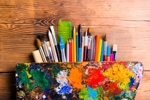 Desk with stationary. Studio shot on wooden background.