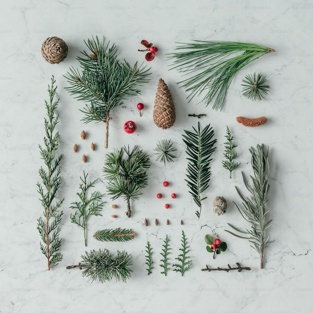 Creative natural layout made of winter things on marble background. Flat lay.