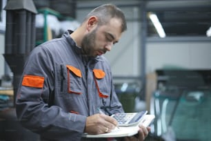 Man reading calculating bills workshop.