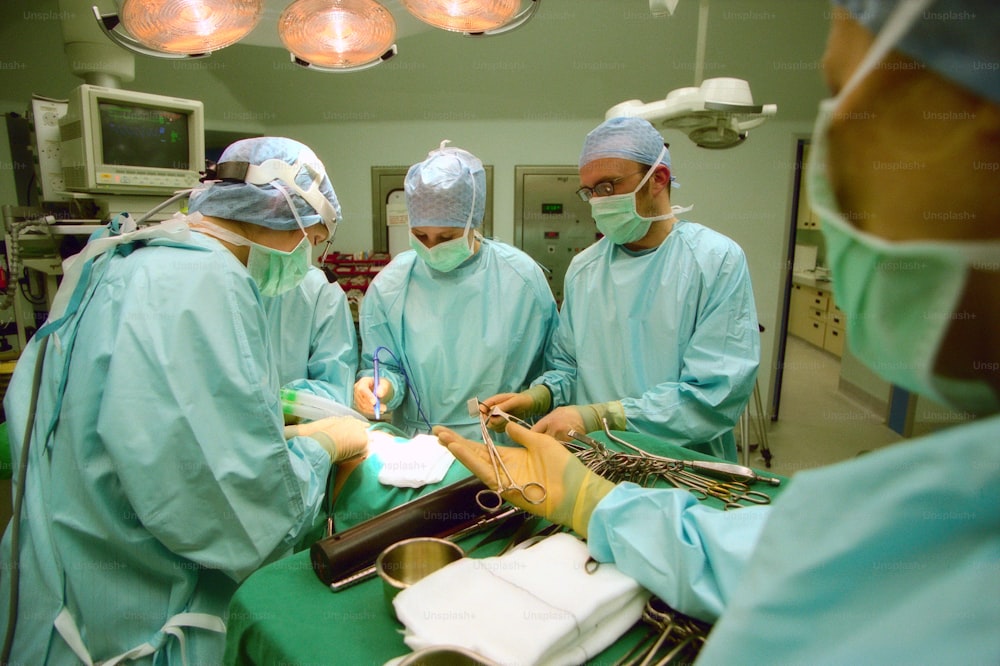 a group of doctors performing surgery in a hospital