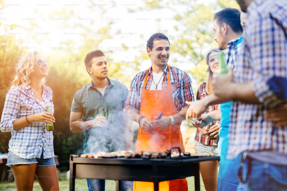 Young people enjoying barbecuing