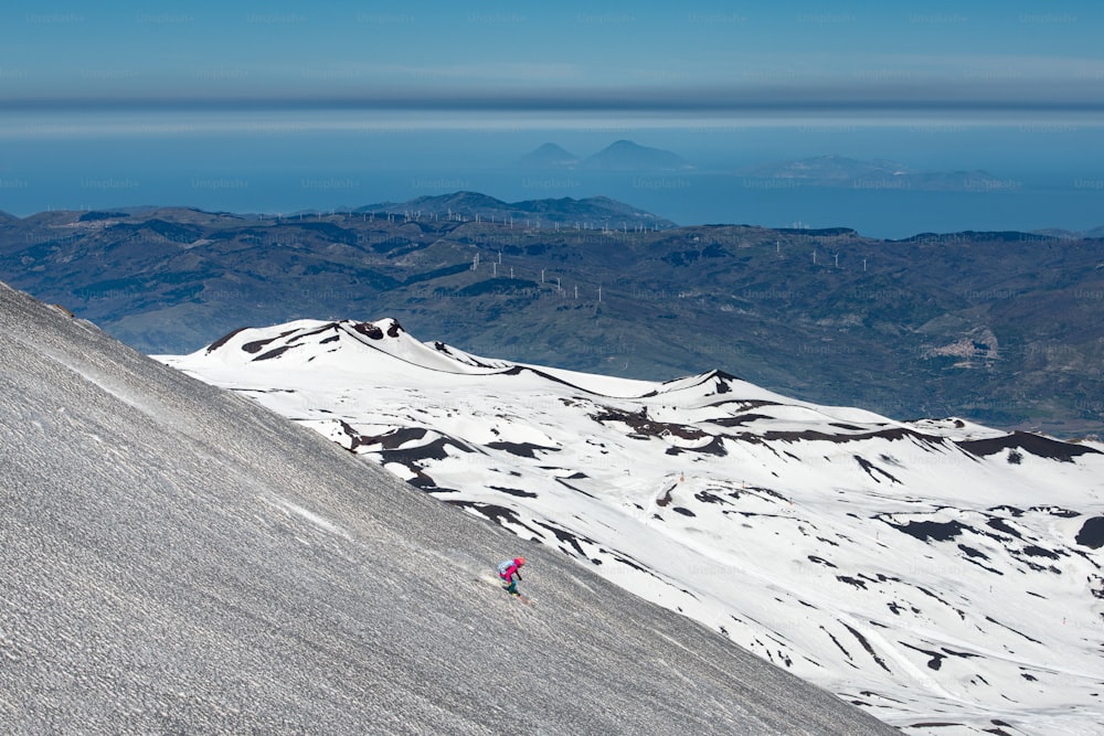 Skiing on the Etna volcano with the background of Lipari Stromboli Aeolian Islands Italy