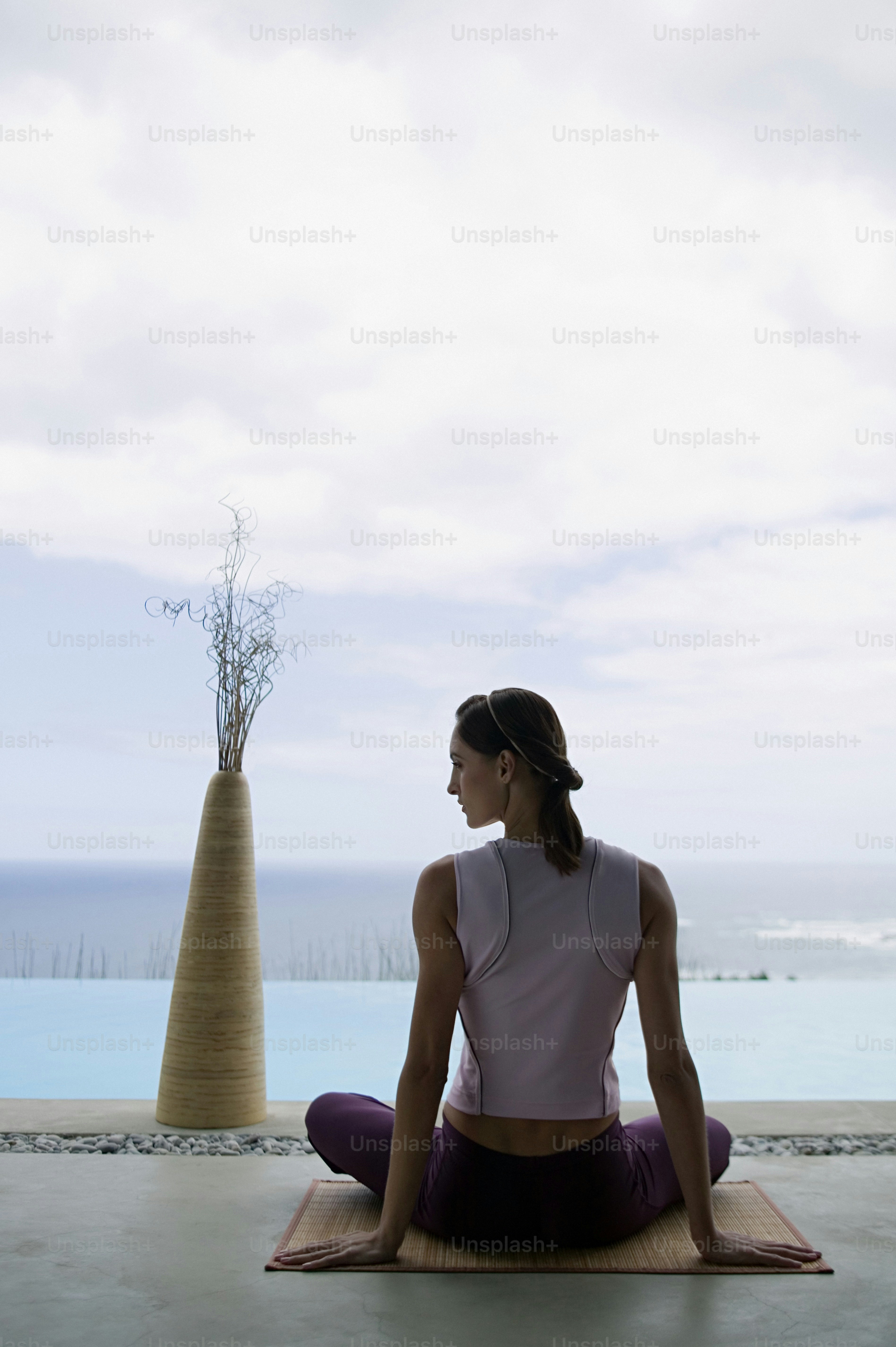 A woman in a white outfit doing a yoga pose photo – Yoga Image on Unsplash