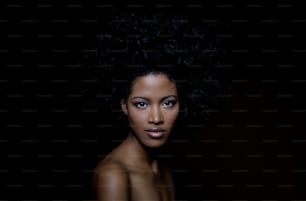 a woman with an afro is posing for a picture