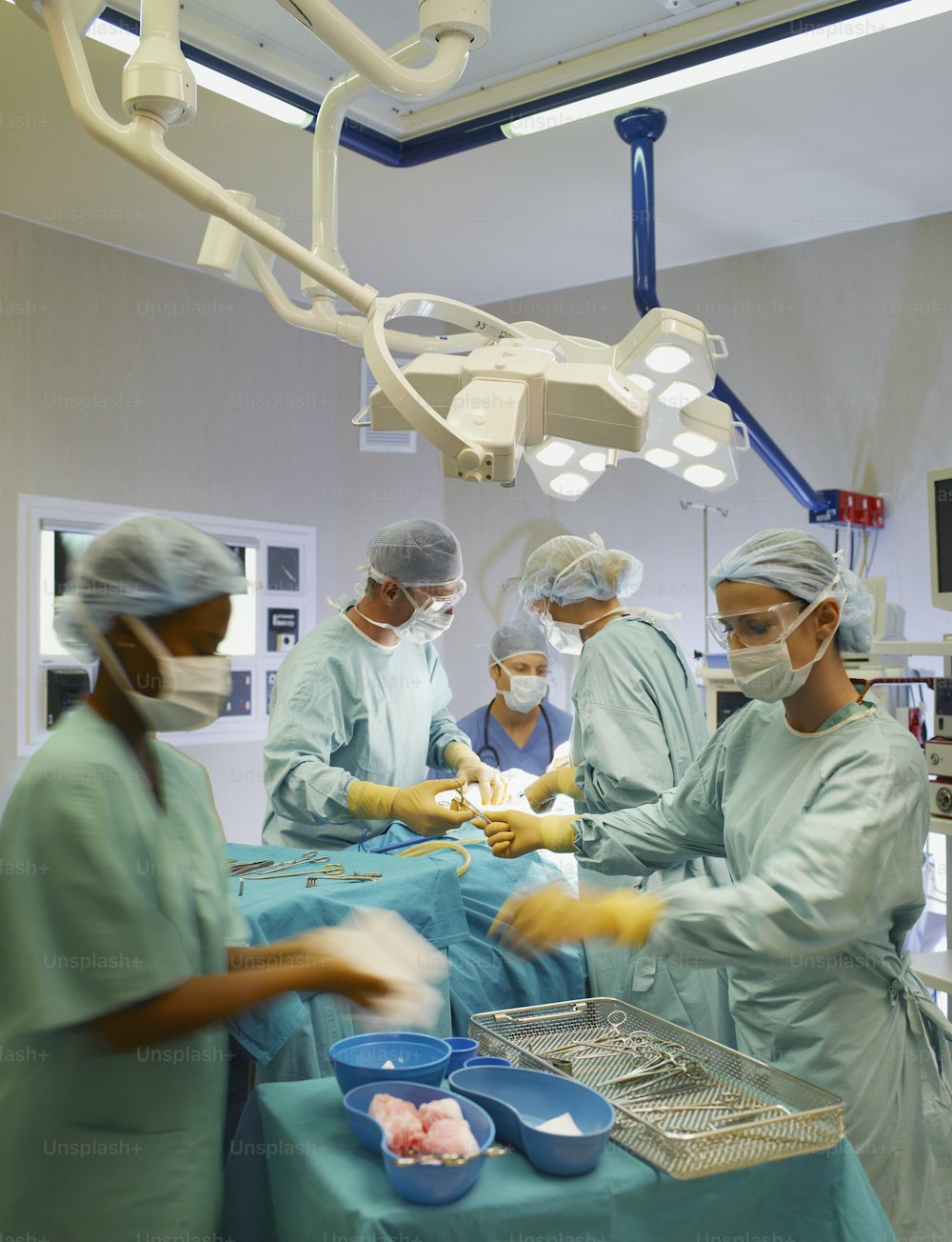 a group of doctors in scrubs preparing food