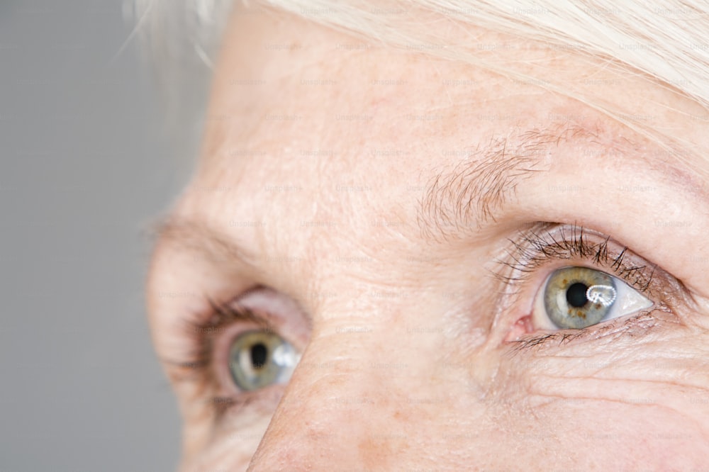 a close up of an older woman's eye