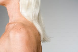 the back of a woman's head with white hair