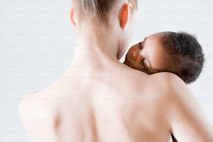 a woman holding a baby in her arms