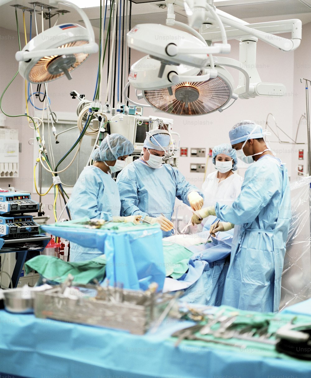 a group of doctors performing surgery in a hospital