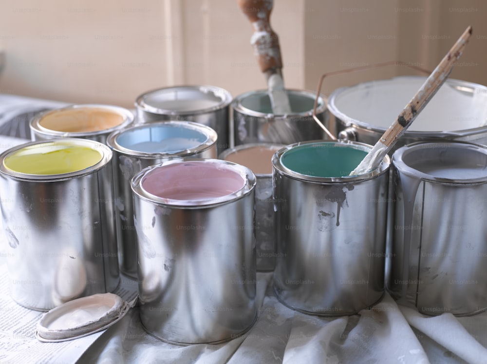 a group of paint cans sitting on top of a table