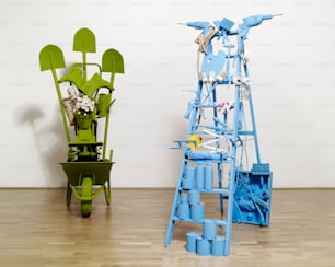 a green chair and a blue and white sculpture