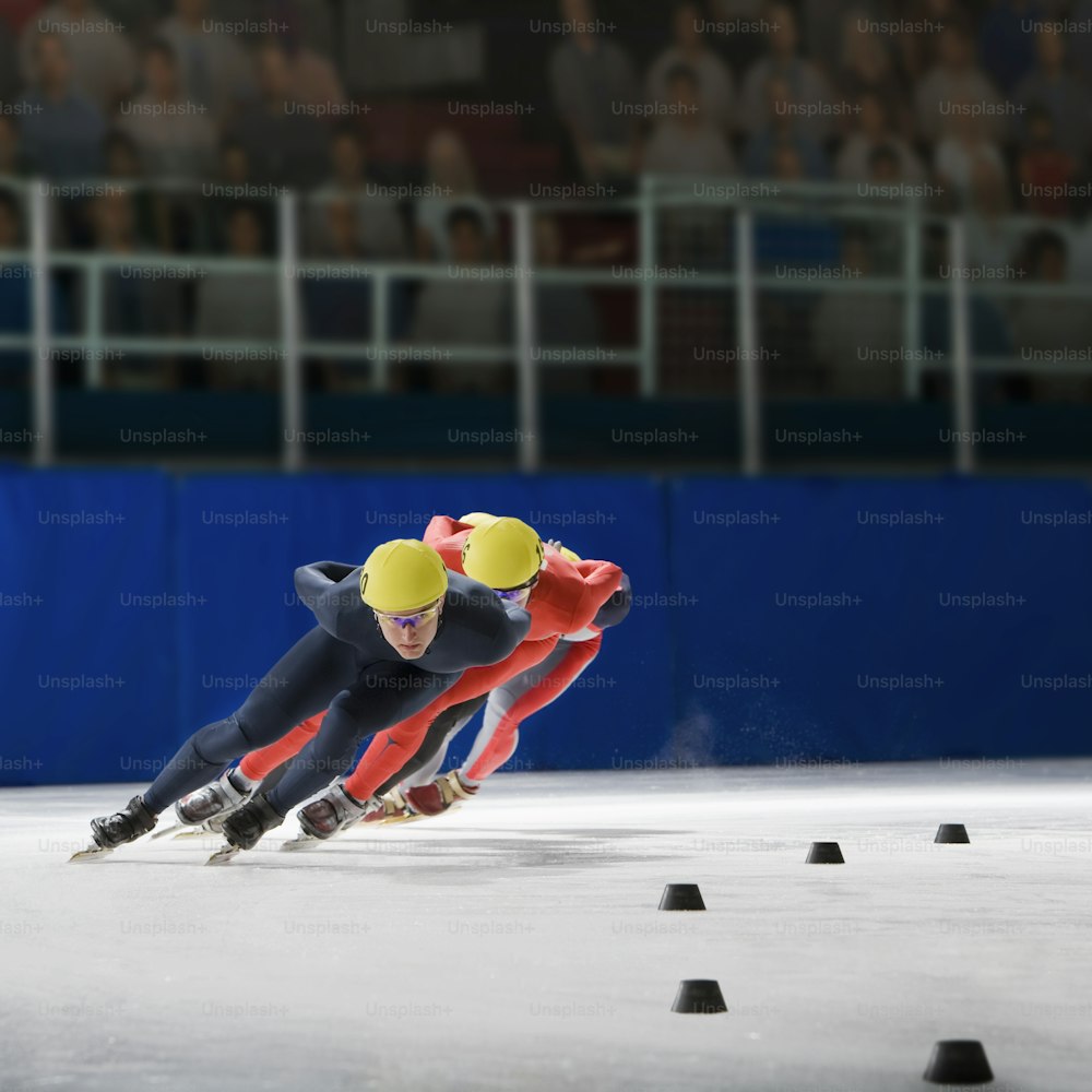 a couple of people that are on some ice