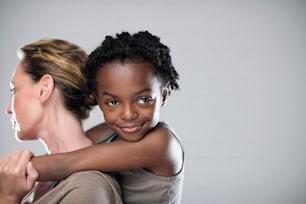 a woman holding a child in her arms